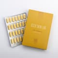 krabička vitamínu C a vedle ní položené platíčko s vitamínem C
